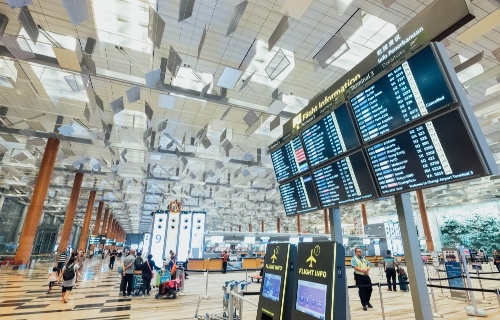 a departure board listing the outbound flights at an airport while you have a layover